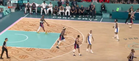 Basketball match in action, showcasing teams competing during a live game moment