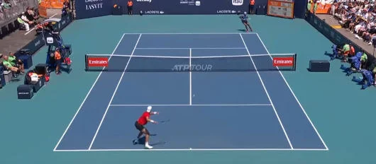 Tennis player preparing for a powerful serve, highlighting strategic thinking in tennis betting